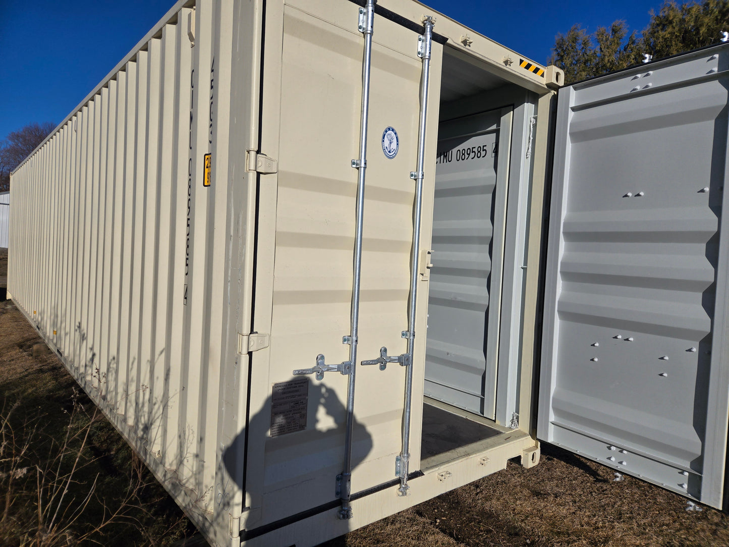 Container with open door on a clear day